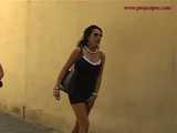 016141 Eve Tries To Hide Beside A Parked Motorcycle As She Pees In The Street 4