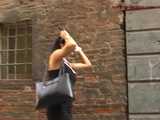 016141 Eve Tries To Hide Beside A Parked Motorcycle As She Pees In The Street 5