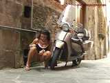 016141 Eve Tries To Hide Beside A Parked Motorcycle As She Pees In The Street 8