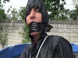 Watch Sandra enjoying Bondage  in her shiny nylon  Rainwear outside 5