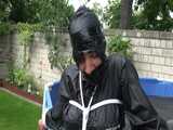 Watch Sandra enjoying Bondage  in her shiny nylon  Rainwear outside 8